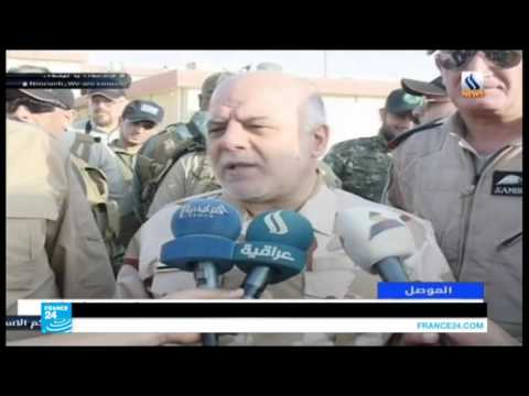 شاهد حيدر العبادي يحيي أبطال الحشد الشعبي