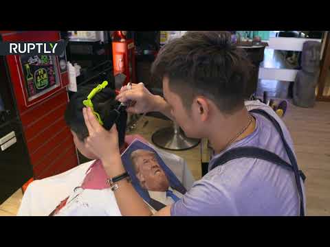 اهد حلاق تايواني يرسم صور المشاهير على رؤوس زبائنه