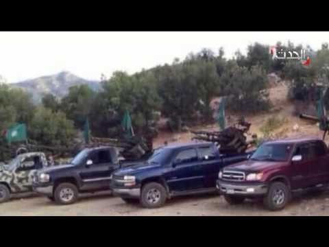 شاهد سيارات ترفع رايات حركة أمل تحمل رشاشات ثقيلة