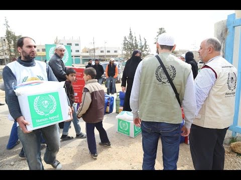 شاهد توزيع 100 ألف طرد غذائي على اللاجئين السوريين والعراقيين